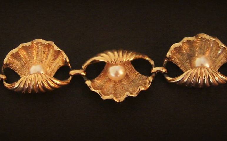 Shell and Faux Pearl gold tone bracelet