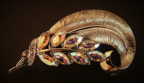 Coro Pegasus gold tone feather brooch with aurora borealis