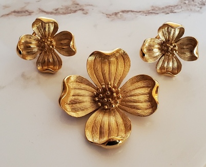 Crown Trifari dogwood flower brooch and clip earrings