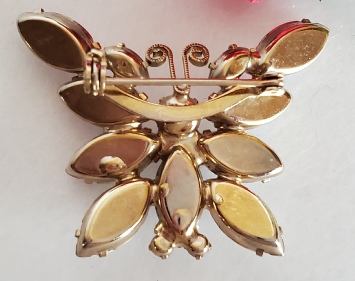 D&E Juliana milk glass and gold-tone butterfly booch pin back