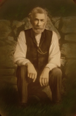 portrait of a man sitting in the garden