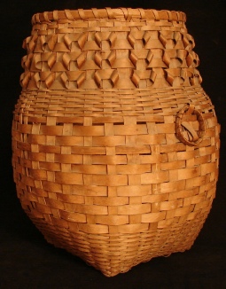 Native American large woven feather basket, side