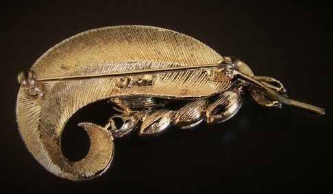 Coro Pegasus gold tone feather brooch with aurora borealis back
