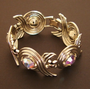 Sarah Coventry Aurora Swirl line gold tone bracelet