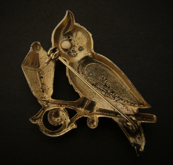gold tone owl with lamp pin marked Spain, back